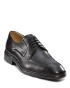 These polished dress shoes are fit to be tied, featuring a slight heel.