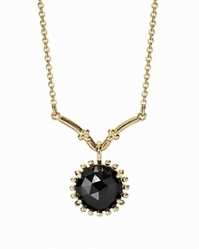 A faceted melanite stone in a beaded setting dangles delicately from a 14K gold chain. Necklace by PANDORA.