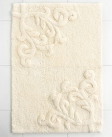 Featuring one of the most elegant designs from Lenox, this Opal Innocence bath rug creates a refined look for your bathroom. Crafted with a beautiful design of scrolling vines, this tufted and carved cotton rug carries with it exceptional style and grace.