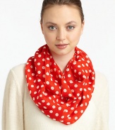 Lightweight wool is adorned with a 60's-inspired polka dot print for mod style.WoolAbout 17 X 77Dry cleanImported