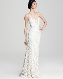 The epitome of modern romance, this Theia silk gown boasts a graceful cascade of delicate petals.