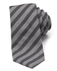 Crafted in a soft wool and silk blend, this handsome textured tie uses muted stripe tones to bring a quiet sophistication to even your casual look.