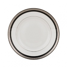 Intricately textured platinum rings on pure white china paired with the fashionably modern look of ebony creates a new sophistication for your table.