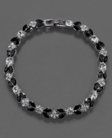 A versatile bracelet that adds a touch of pretty to every look, this Monet flex bracelet features jet stones and crystal accents set in silvertone mixed metal. Approximate length: 7-1/4 inches.