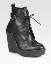 Adjustable, wrap-around buckle strap adds rocker charm to this lace-up leather ankle boot, while a rubber wedge and platform add the right amount of height. Rubber wedge, 5 (125mm)Rubber platform, 1 (25mm)Compares to a 4 heel (100mm)Leather upperLeather liningRubber solePadded insoleMade in Italy