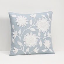 This decorative pillow is softly hued and features cheerfully nodding flowers on the vine for a classically pretty appeal.