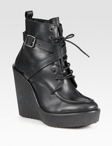 Adjustable, wrap-around buckle strap adds rocker charm to this lace-up leather ankle boot, while a rubber wedge and platform add the right amount of height. Rubber wedge, 5 (125mm)Rubber platform, 1 (25mm)Compares to a 4 heel (100mm)Leather upperLeather liningRubber solePadded insoleMade in Italy