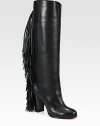 Rocker-chic fringe adds movement to this towering boot of sumptuous Italian leather. Stacked heel, 3½ (90mm)Shaft, 15½Leg circumference, 14Leather upperPull-on styleLeather liningSignature red leather solePadded insoleMade in Italy