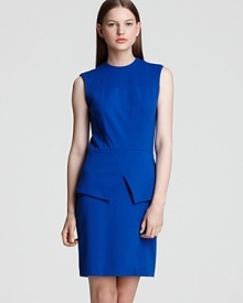 Structured and svelte, this sleeveless dress from Tibi features structured seaming details and a crisscross cutout peplum waist - a fabulous transition dress for work to dinner.