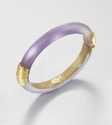 From the Lucite Collection. A sleek bangle of hand-sculpted, hand-painted Lucite, accented with crinkle-textured goldtone bands at the hinge and closure.LuciteGoldtoneDiameter, about 2.5Width, about .4Hinged, with magnetic closureMade in USA