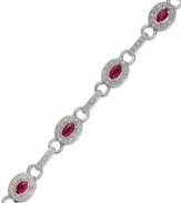 A beautiful combination. Rubies (2-1/2 ct. t.w.) and single-cut diamonds (1/4 ct. t.w.) come together in stunning fashion in this oval link bracelet. Set in sterling silver. Approximate length: 7 inches.