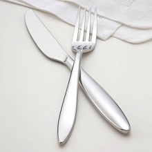 Contemporary design, graceful and curvaceous, this pattern seamlessly complements both modern and traditional table settings. Includes eight 5-piece place settings and 5 serving pieces - tablespoon, pierced tablespoon, cold meat fork, sugar spoon and butter knife.