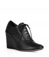 Channel trend-right style in these lace-up wedges from Repetto - Round toe, lace-up front, wedge heel - Style with pleat-front shorts, a tie-neck blouse, and an oversized cardigan