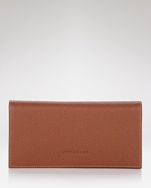 A classic bifold wallet in pebbled leather from Longchamp.