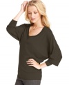 An exposed zipper detail and raw hems up the edge on this RACHEL Rachel Roy top -- a hot fall layering piece!