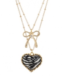 Earn your stripes. A chic zebra pattern defines this dramatic double-row necklace from Betsey Johnson. Featuring heart and bow emblems along with sparkling crystal accents, it's crafted in gold tone mixed metal. Item comes packaged in a signature gift box. Approximate length: 16 inches + 3-inch extender. Approximate drop: 1 inch (heart), 3/4 inch (bow).