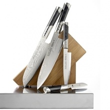 Henckels Miyabi 7000D 5-Piece Set. Japanese tradition and German technology combine to forge these incomparable kitchen knives. Blades are made from 33 layers of high-quality steel in a damask design to provide exceptional sharpness, perfect balance and comfortable weight. Set includes 3 Kudamono, 5 utility, 7 santoku, 8 chef's and a bamboo block.