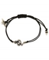 Sink your teeth into fierce fashion. This RACHEL Rachel Roy bracelet showcases a snake charm with glass stone accents. An adjustable waxed cotton cord holds it all together. Set in silver tone mixed metal. Approximate diameter: 1 inches. Adjustable from 1 inch to 7-1/4 inches.