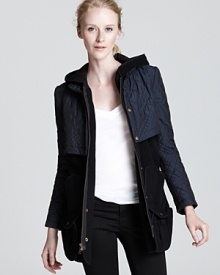 Luxe versatility is yours with this convertible Gryphon coat-turn-vest. The elevated layer is perfected for the transitional weather-wear it with its hood up or down, sleeves on or off and always with the season's coolest jeans.