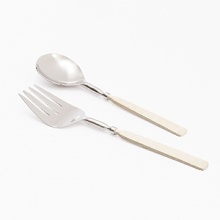 Bring the beauty of the beach to your table with the Simply Designz Ivory Collection. Handcrafted with delicate ivory handles, this serving set is an elegant way to serve salad or fruit.