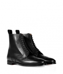 Luxurious boot in high-polished black calf leather - Stylish wingtip design inspired by classic mens footwear  - Features a narrow shape, rounded toe, thin laces to ankle, and a mini block heel - Favorite shoe with a pantsuit, knit skirt or skinny jeans