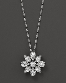 Diamonds set in a 14K. white gold flower pendant.