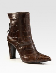 Instantly chic boot hitting just above the ankle, rendered in crocodile-embossed leather for a luxurious effect. Self-covered heel, 3¾ (95mm)Crocodile-print leather upperPoint toeBack zipLeather liningRubber solePadded insoleImported