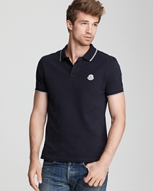 Classic polo with white stripe trim and embroidered logo at the left chest.