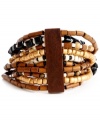 An earthy blend of brown, black and white beading make Haskell's bohemian style a neutral must. Bracelet stretches to fit wrist and blends perfectly with bold summer ensembles. Set in mixed metal with glass and wooden accents. Approximate length: 7-1/2 inches.