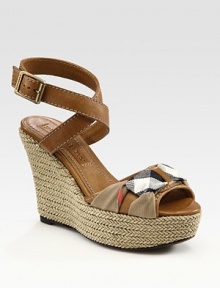 Braided straw wedge accompanies leather, wrap-around straps and a signature check overlay. Straw-covered wedge, 4½ (115mm)Covered platform, 1½ (40mm)Compares to a 3 heel (75mm)Leather and canvas upperLeather lining and solePadded insoleMade in ItalyOUR FIT MODEL RECOMMENDS ordering one size up as this style runs small. 