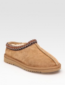 Stay cozy in a this classic suede style with plush shearling lining and embroidered details. Stretch suede upper Shearling lining Foam sole Padded insole Imported