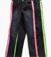 Make them look. She'll turn heads in these neon-stripe jeans from Baby Phat.