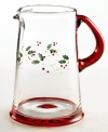 Even water feels more spirited in this festive glass pitcher! Inspired by the timeless Winterberry pattern, it features hand-painted holly leaves and berries accented with etched details and a rich red handle and base.