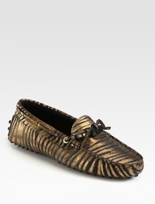 Moccasin-inspired silhouette of metallic leather takes on an exotic zebra print for a fashionable look. Zebra-print metallic leather upperLeather liningRubber solePadded insoleMade in Italy