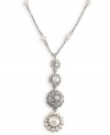 Layer on old-world elegance with this romantic necklace by Carolee. Dramatic pendant features crystal, glass pearl and intricate bejeweled medallion. Crafted in imitation rhodium-plated mixed metal. Approximate length: 16 inches + 2-inch extender. Approximate drop: 2-1/4 inches.