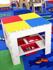 The surface of this sturdy table has colorful panels compatible with Duplo building pieces so it's the perfect place for kids to stack up the blocks and make fantastical creations.Duplo-compatible surfaceLower shelf with four plastic storage bins18 square X 16HWoodMade in USA Please note: Blocks and chairs not included. 