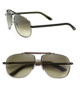 Iconic aviator style crafted in a sleek metal design. Available in shiny gun frames with olive green lenses.Metal100% UV ProtectionMade in Italy