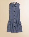 Soft chambray in a sophisticated style, with big buttons, contrast topstitching and a shapely dropped waist.Rounded shirt collarButton shoulder epaulettesSleevelessButton frontDropped waistPleated skirtOversized flap and patch pocketsCottonMachine washImported Please note: Number of buttons may vary depending on size ordered. 