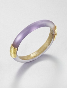 From the Lucite Collection. A sleek bangle of hand-sculpted, hand-painted Lucite, accented with crinkle-textured goldtone bands at the hinge and closure.LuciteGoldtoneDiameter, about 2.5Width, about .4Hinged, with magnetic closureMade in USA