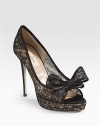 Utterly romantic in silk-trimmed lace with a beautiful big bow at the peep toe.Self-covered heel, 5 (125mm) Self-covered platform, 1¼ (30mm) Compares to a 3¾ heel (95mm) Peep toe Leather lining and sole Padded insole Made in ItalyOUR FIT MODEL RECOMMENDS ordering true size. 