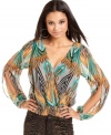 Work the party circuit in a top that has pop power! This blouson style from Baby Phat features an exotic print and sexy open-back design.