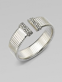 An elegantly ribbed, flexible cuff with Swarovski crystal caps.CrystalSilverplatedDiameter, about 2¼Made in Italy