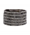 Inject instant glamour into any outfit with R.J.Grazianos set of stretchy bangles, a chic and easy choice for dressing up your look - Prong set stones, slips on - Wear with edgy separates, or as a finishing touch to cocktail dresses