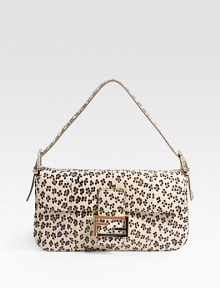 An exotic iteration of the iconic silhouette, features vibrant leopard spots on luxurious watersnake.Shoulder strap, 5 drop Flap closure One inside zip pocket Linen lining 11W X 5½H X 2D Made in Italy