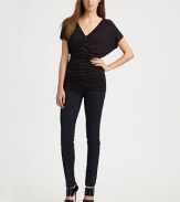 Luxe jersey skims the body in a softly-ruched V-neck.Dropped shouldersShort sleevesCenter ruchingAbout 28 from shoulder to hem94% rayon/6% spandexDry cleanMade in USA