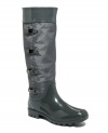 Stand up to rainy days with fashionable function. Tall Ivy rain boots by Calvin Klein crafted of nylon and rubber feature a row of fashion-forward snaps and buckles.