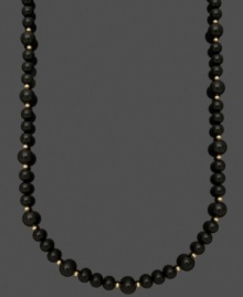 Bold beads create a standout look. A simple strand of polished onyx beads (8-10 mm) mixed with 14k gold accent beads and clasp make for a timeless look. Approximate length: 18 inches.