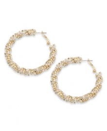 Dazzling by design. Alfani adds a glamorous touch to traditional hoop earrings with a chic, twisted design and sparkling glass accents. Crafted in gold plated mixed metal. Approximate diameter: 1-1/2 inches.