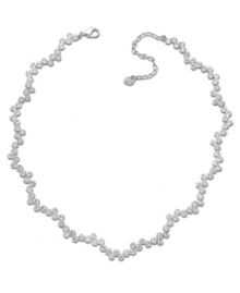 Swarovski's stunning rhodium-plated mixed metal necklace adds instant sophistication to any outfit, by day or night. Timeless, feminine, and graceful, the fluid silhouette sparkles in clear crystal pavé. Approximate length: 15 inches + 2-inch extender.