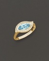 Pavé diamonds frame a faceted blue topaz, set in a 18K gold leaf. By Carelle.